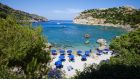 Anthony Quinn Bay on Rhodes island in Greece. Which? found that a package trip to the island worked out more than €430 cheaper than an identical DIY holiday. Photograph: Getty Images