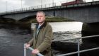 Dr Paul Armstrong at the Lifford Bridge beside his practice in Lifford, Co Donegal. Photograph: Joe Dunne
