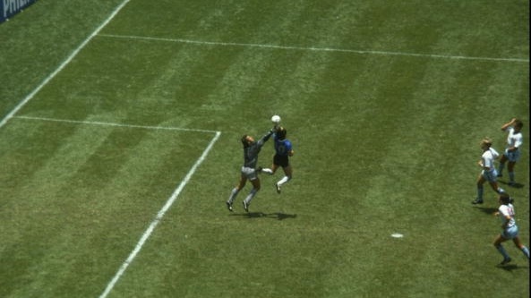 Diego Maradona handles the ball past Peter Shilton of England to score the opening goal of the 1986 World Cup quarter-final in Mexico. File photograph: Allsport