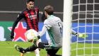 Milan’s Brahim Diaz scores against Celtic’s goalkeeper Vassilis Barkas. Photograph: EPA