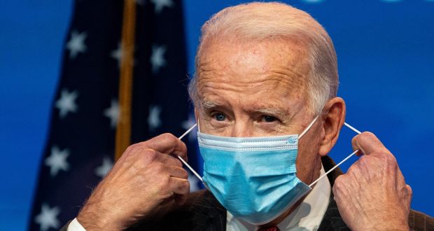 Joe Biden: ‘Just 100 days to mask — not forever, just 100 days. And I think we’ll see a significant reduction.’ Photograph: Ruth Fremson/The New York Times