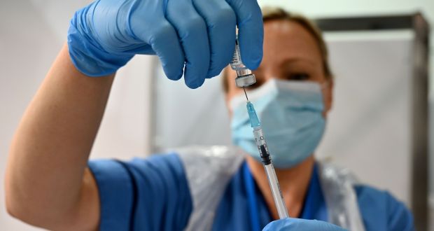 Nurse Paula McMahon prepares a dose of the Pfizer-BioNTech Covid-19 vaccine at the Louisa Jordan Hospital in Glasgow. Photograph: Jeff J Mitchell /Pool/AFP