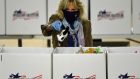 Jill Biden, wife of the president-elect, joins Operation Gratitude as she assembles care packages for deployed US troops, on Friday, in Washington. Photograph: Olivier Douliery/AFP via Getty Images