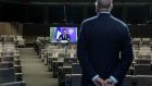 European Council President Charles Michel listens as French President Emmanuel Macron appears on a screen to deliver a speech during the Climate Ambition Summit 2020 in Brussels on Saturday. Photograph: Getty Images