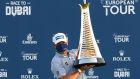  Lee Westwood celebrates with the Race to Dubai Trophy. Photograph: Getty Images