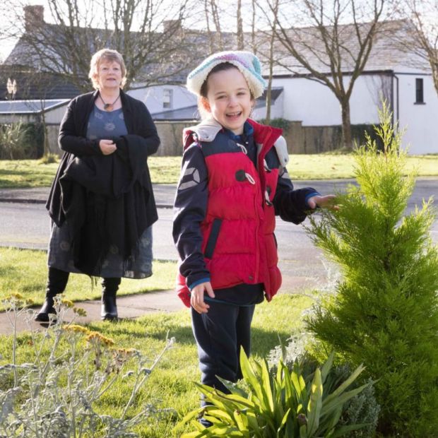Six-year-old Catherine Crimmins visiting her neighbour Susan Keneally. Photograph: Eamon Ward