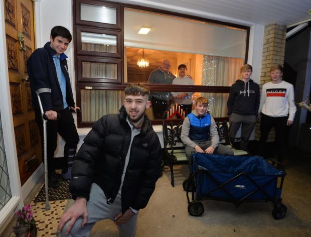 Seapark shoppers Ben Connolly (front), Darragh Maughan (left), Matthew Benner(seated), and Enda and Cillian Rooney; with neighbours Jim and Rita Stanley. Photograph: Alan Betson