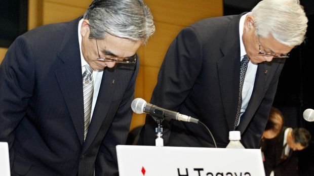 Chairman and CEO of Mitsubishi Motors Yoichiro Okazaki (R) and president and COO Hideyasu Tagaya (L) bow to offer their apology for victims of defects of Mitsubishi’s vehicles during a press conference after their annual shareholders’ meeting at the headquarters in Tokyo, Jun,e 2004. Photograph: Toru Yamanaka/AFP/Getty Images