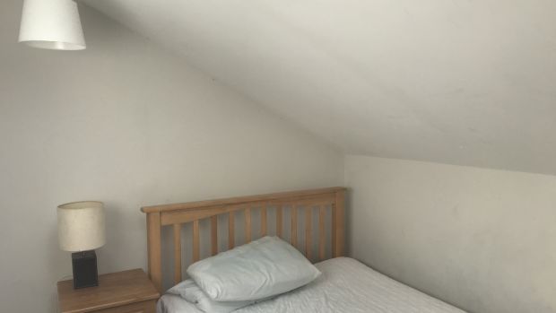Before: The spare attic room was previously used as an bedroom. Photograph: Philip Lauterbach
