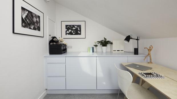 Spare room now is a home office and laundry room. Photograph: Philip Lauterbach