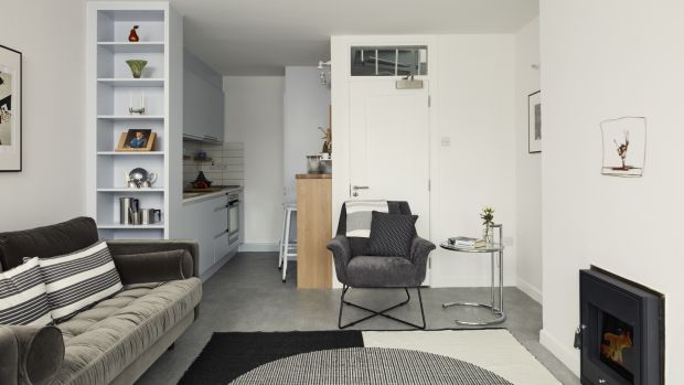 Open plan living room and kitchen after reconfiguration. Photograph: Photograph: Philip Lauterbach