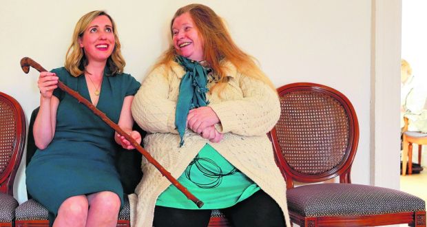 Poetic tradition: Nuala Ní Dhomhnaill presents to Ailbhe Ní Ghearbhuigh with the “Parnell Stick”, which was given to Nuala by Seamus Heaney and has a long and interesting literary lineage. Photograph: Nick Bradshaw