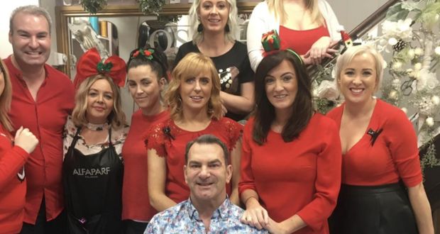 Joseph Byrne with staff at his  Cork city hair salon in 2018. File photograph: Olivia Kelleher