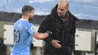 Manchester City manager Pep Guardiola shakes hands with Sergio Agüero after the win over Newcastle. Photo: Peter Powell/POOL/AFP via Getty Images