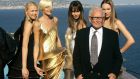 Pierre Cardin stands with models wearing his creations at his villa in Theoule sur Mer, southern France, in 2008. Photograph: Lionel Cironneau/AP
