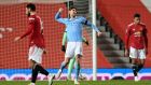 Manchester City’s John Stones celebrates at the final whistle at Old Trafford. Photograph: PA