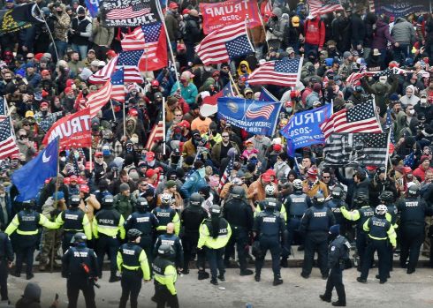 Trump supporters clash with police and security forces as they storm the US Capitol in Washington on Wednesday. Photograph: Olivier Douliery/AFP via Getty Images