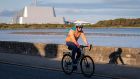 Cyclist on Strand Road, Sandymount: A two-way cycle route  is due to come into operation next month for a six-month trial. Photograph: Crispin Rodwell 