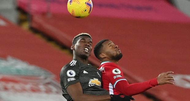 Manchester United’s Paul Pogba vies for the ball with  Liverpool’s  Georginio Wijnaldum during the  Premier League  match at Anfield. Photograph: Paul Ellis/AFP via Getty Images