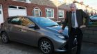  Former garda Frank Cullinane   with his hybrid car that had the converter stolen from it. Photograph: Laura Hutton