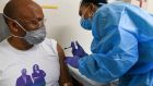 A patient receives Novavax’s Covid-19 vaccine in a trial in the US. The company has announced results from a vaccine trial in the UK. Photograph: Kenny Holston/The New York Times