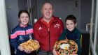 Phil Quinlan, with his children Joe and Eileen, with some food they prepared at home in Navan, Co. Meath. Photograph: Dara MacDónaill/The Irish Times