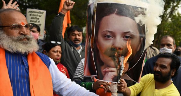 Activists of United Hindu Front burn an effigy with a picture of Swedish climate activist Greta Thunberg during a demonstration in New Delhi on Thursday. Photograph:  Money Sharma/AFP via Getty Images