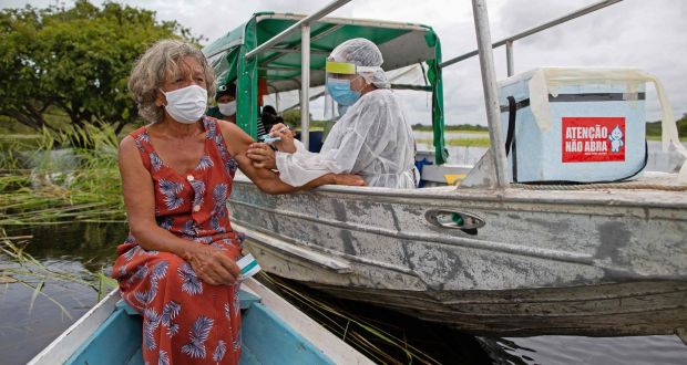 Olga D’arc Pimentel, 72, is vaccinated  in the Nossa Senhora Livramento community on the banks of the Rio Negro in  Brazil. The more widespread the virus, the greater is the likelihood of harmful mutations. Photograph: AFP via Getty