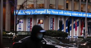 News headlines on the impeachment trial of Donald Trump outside Fox headquarters in New York. Photograph: Spencer Platt/Getty