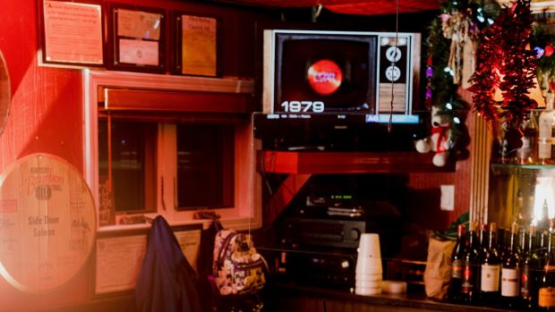The Side Door Saloon in Petoskey, Michigan. Larry Cummings, who died of Covid-19 in March at the age of 76, liked to visit the bar after work on Mondays. Photograph: Lyndon French/New York Times