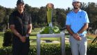 Max Homa  stands with the trophy and tournament host Tiger Woods after defeating Tony Finau of the United States  in a playoff to win The Genesis Invitational at Riviera Country Club  in Pacific Palisades, California. Photograph: Harry How/Getty Images