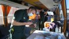 Paramedic Andrew Parker prepares a vaccine inside a holiday coach  near Inverness, Scotland, which is being used  as a mobile coronavirus vaccination centre. Photograph: Andrew Milligan/PA Wire