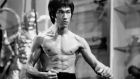 Actor and martial artist Bruce Lee poses for a Warner Bros publicity still for the film Enter the Dragon in 1973 in Hong Kong. Photograph: Michael Ochs Archives/Getty Images