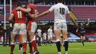Josh Adams and Jonathan Davies celebrate a try as England outhalf George Ford appeals to referee Pascal Gauzere. Photograph: Getty Images