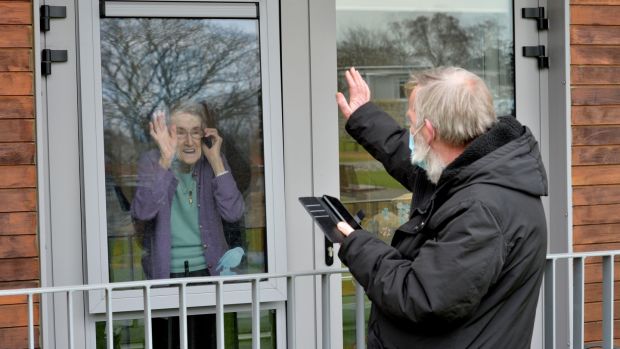 Sheila O’Connell, a resident of St Mary’s, gets a window visit from her son Tony O’Connell. Photograph: Alan Betson/The Irish Times