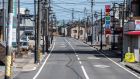 The main street of Namie in Fukushima prefecture. Just 1,200 of its 21,000 residents have so far returned. Photograph:   Philip Fong/AFP via Getty Images