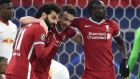 Liverpool’s  Mohamed Salah celebrates with Diogo Jota  and Sadio Mane after scoring the  first goal during the Champions league last 16 second leg game against  RB Leipzig at Puskas Arena in Budapest. Photograph:  Attila Kisbenedek/AFP via Getty Images