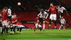 Simon Kjær heads home  AC Milan’s late equaliser in the Europa League round of 16 first leg against Manchester United at Old Trafford. Photograph: Laurence Griffiths/Getty Images