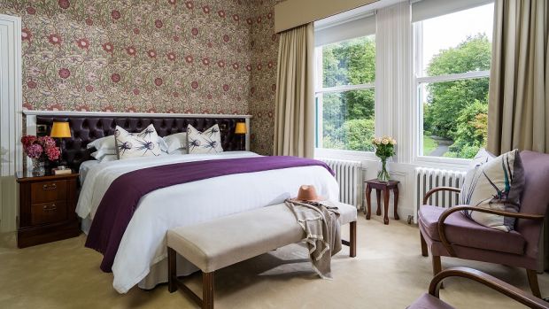Bedrooms feature antiques and heirlooms alongside modern conveniences such as flatscreen TVs and Nespresso machines.