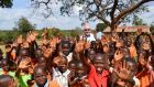 Former minister and Kerry footballer Jimmy Deenihan is pictured during a 2019 visit to Nyaminyagwe village in Bugiri District, Uganda. Irish charity Goal has helped to build a water borehole to provide the  community with access to clean water. 