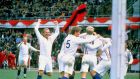 Actor Michael Caine and England player Bobby Moore of the POW XI celebrate during a match against Germany for the film Escape to Victory. Mandatory Credit: Allsport UK /Allsport