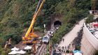 Rescue workers remove  part of a derailed train in Taiwan. Photograph: Chiang Ying-ying/AP Photo