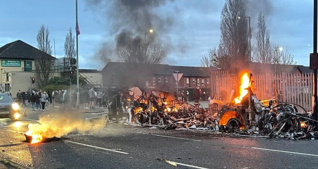 The wreckage of a bus on fire on the Shankill Road in Belfast. Photograph: Liam McBurney/PA Wire 
