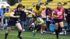  Raymond Rhule of La Rochelle kicks the ball past Sale’s Simon Hammersley  to score their fourth try during the Heineken Champions Cup quarter-final at Stade Marcel Deflandre  in La Rochelle. Photograph: Lionel Hahn/Getty Images