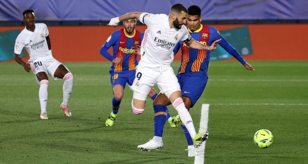  Karim Benzema scores Real Madrid’s first goal during the La Liga  match against Barcelona at Estadio Alfredo Di Stefano  in Madrid. Photograph: Angel Martinez/Getty Images