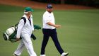 Shane Lowry and his caddie Brian ‘Bo’  Martin walk to the 12th tee during the first round of the Masters at Augusta National Golf Club. Photograph: Mike Ehrmann/Getty Images