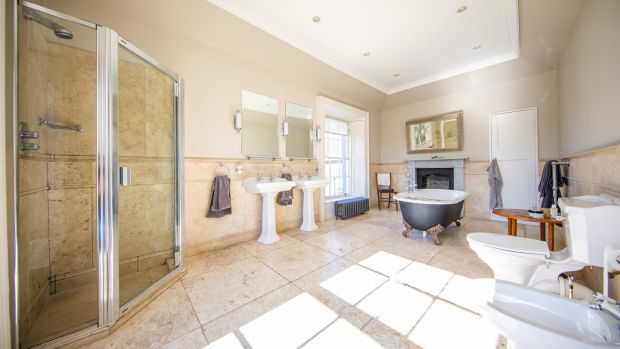 Large bathroom with free-standing bath