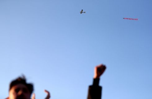 A plane with a 'Say No To Super League' banner flies over Elland Road. Photograph: PA