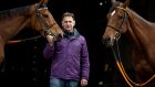 Trainer Henry De Bromheald with Gold Cup winner Minella Indo and Champion Hurdle winner Honeysuckle at his yard in Waterford ahead of the Punchestown Festival. Photograph: Morgan Treacy/Inpho/PaA 