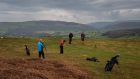   Golfers negotiate the seventh hole at the reborn Rhayader Golf Links in Wales. During the coronavirus pandemic, Chris Powell became obsessed with his Welsh town’s golf course, long lost to time and the land. Then he rebuilt it, in order to play for a single day. Photograph: Phil Hatcher-Moore/The New York Times